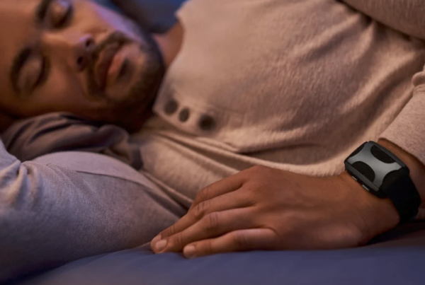 The Apollo Neuro device worn by a male while he is resting